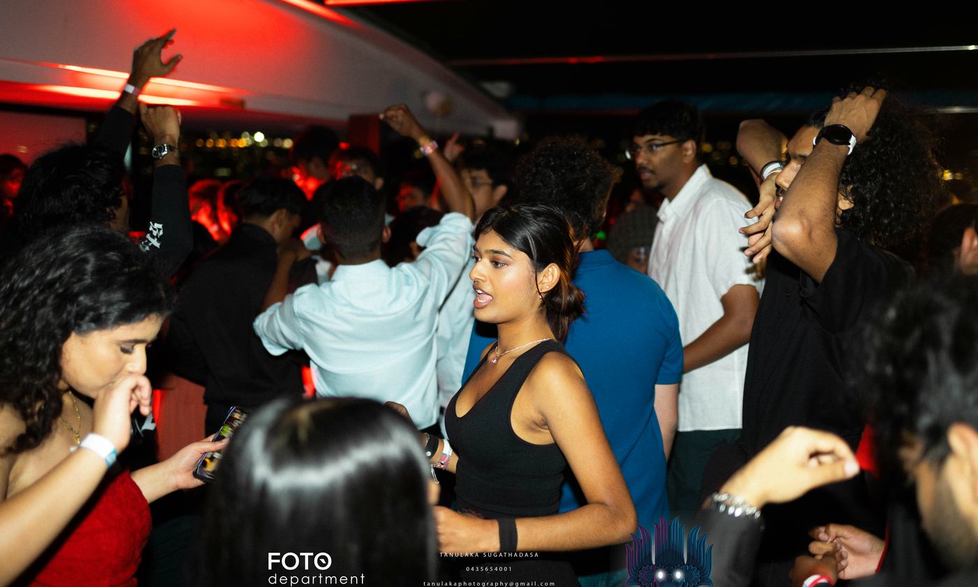 The floor at its fullest, the whole room dancing under coloured light.
