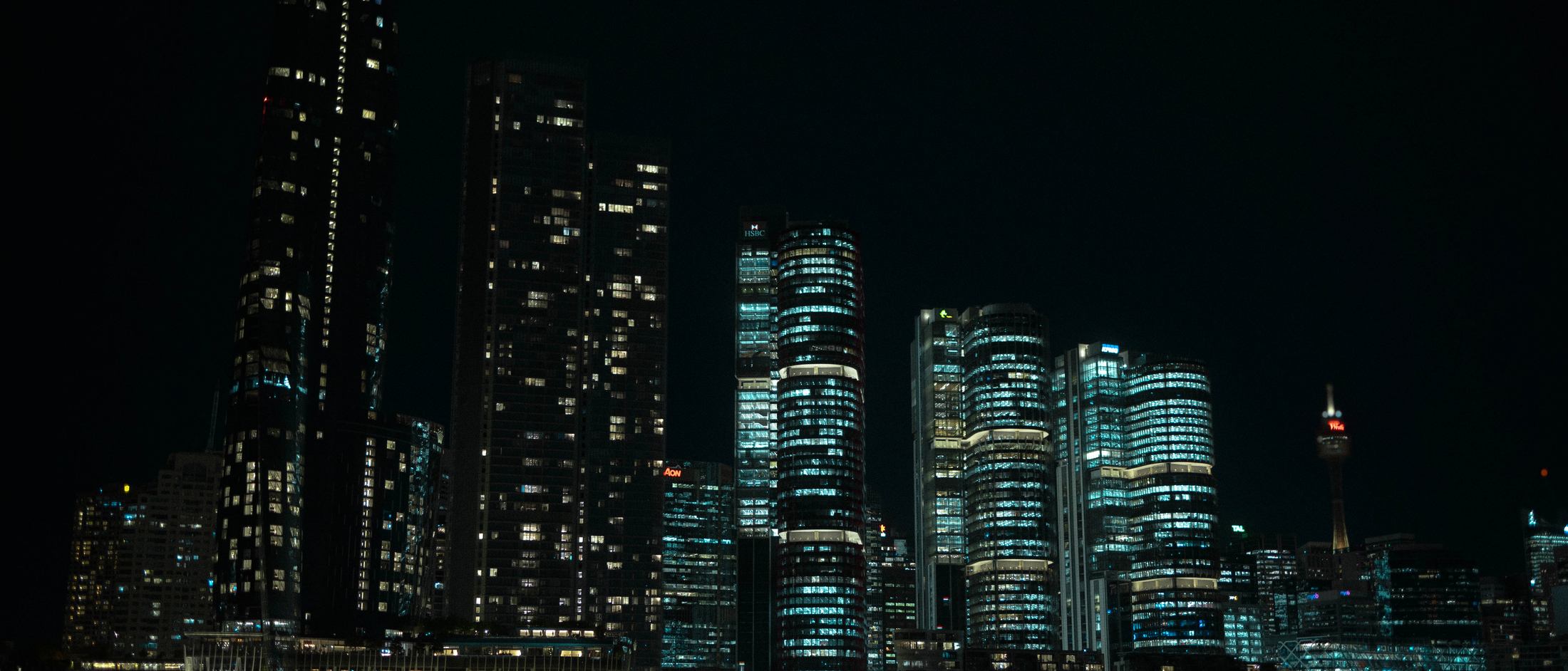 The Sydney skyline at night seen from the water during the cruise.